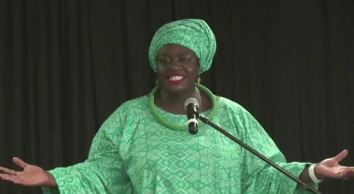 Thoko Elphick-Pooley speaks at a lectern