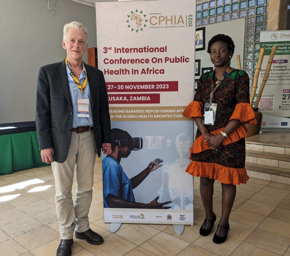 Uniting to Combat NTDs staff members Stuart Halford and Opeyemi Alabi-Hundeyin at CPHIA 2023